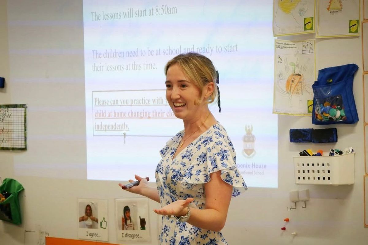 Charlotte teaching in a dynamic international classroom in Japan