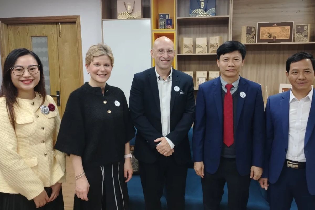 HEI Schools representatives and STH Holdings team standing together during partnership signing ceremony for new preschool campus development in Vietnam 