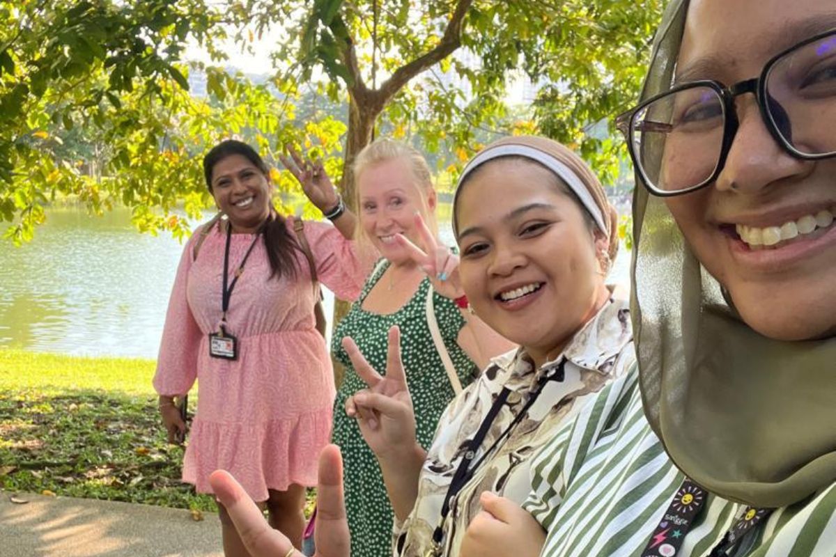 Teachers in Malaysia encouraging creativity and teamwork through outdoor learning experiences