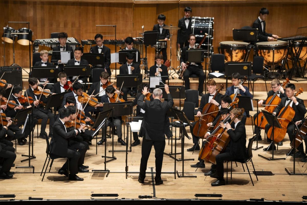 School music class with students practising instruments and developing musical skills