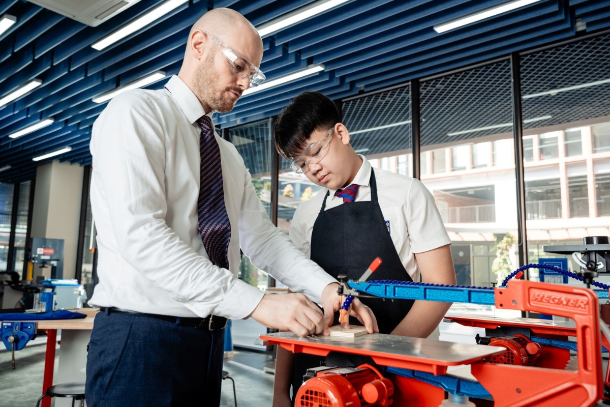 Teacher guiding students through practical life skills and hands-on learning in a school laboratory
