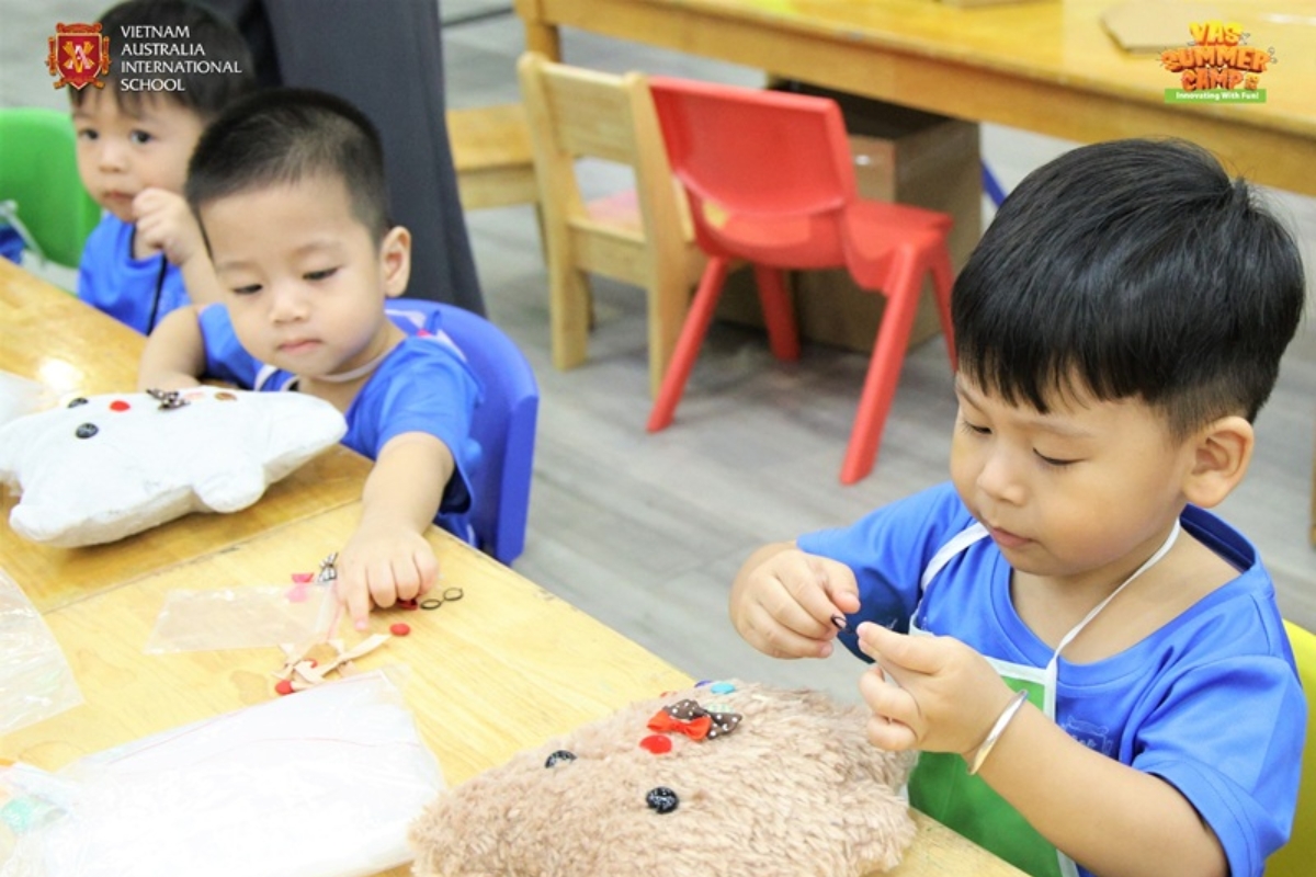 Students carefully complete their teddy bears
