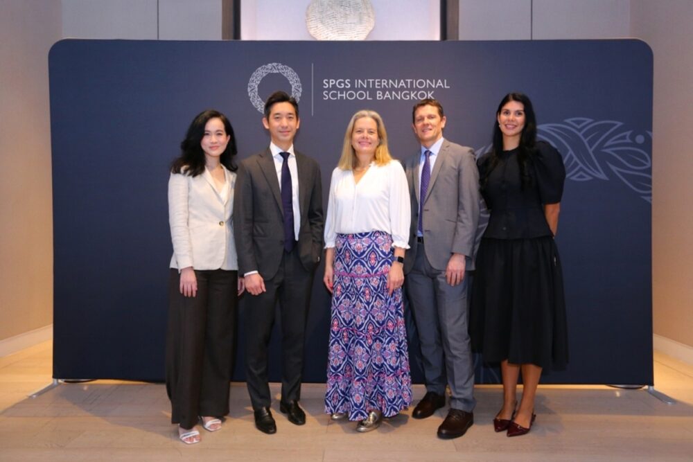 School leaders and representatives pose in front of the SPGS International School Bangkok backdrop during the school's founding celebration. Image via Money and Banking Thailand